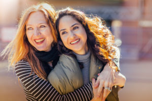 Smiling Mother and teen daughter